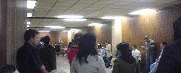 Photo of various people waiting for Jury Selection