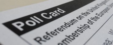 [IMAGE] Close up of a polling card for the UK referendum on leaving the EU. In the foreground, it reads "Poll Card" in white letters on a black background.